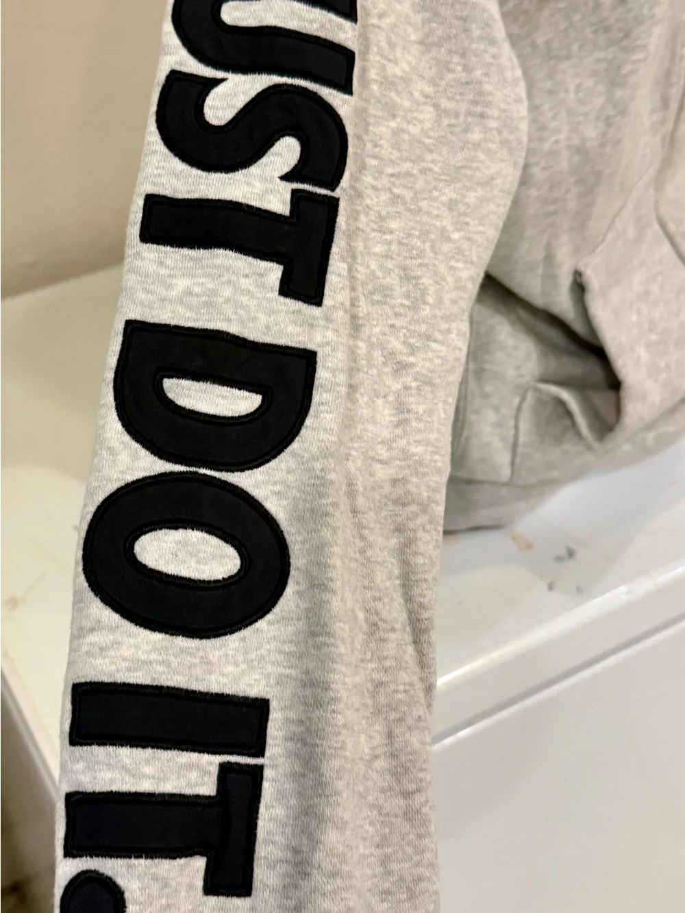 Nike Gray Full-Zip Hoodie with Black Logo and Sleeve Text